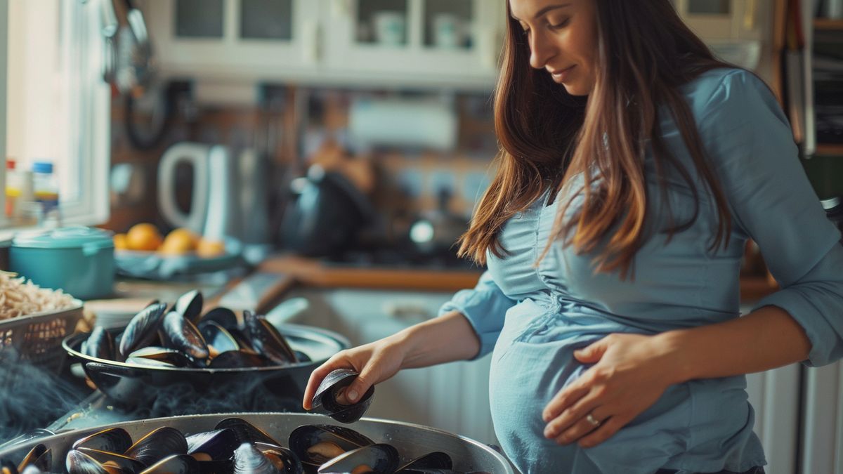 Closeup of a pregnant woman choosing cooked mussels over raw ones